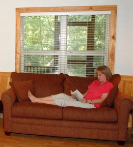 Woman on couch reading